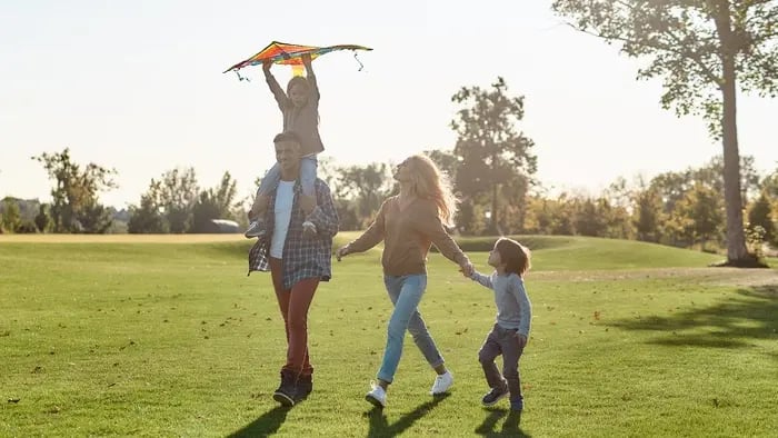 family in grassy field