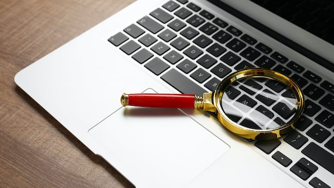 Magnifying glass on laptop